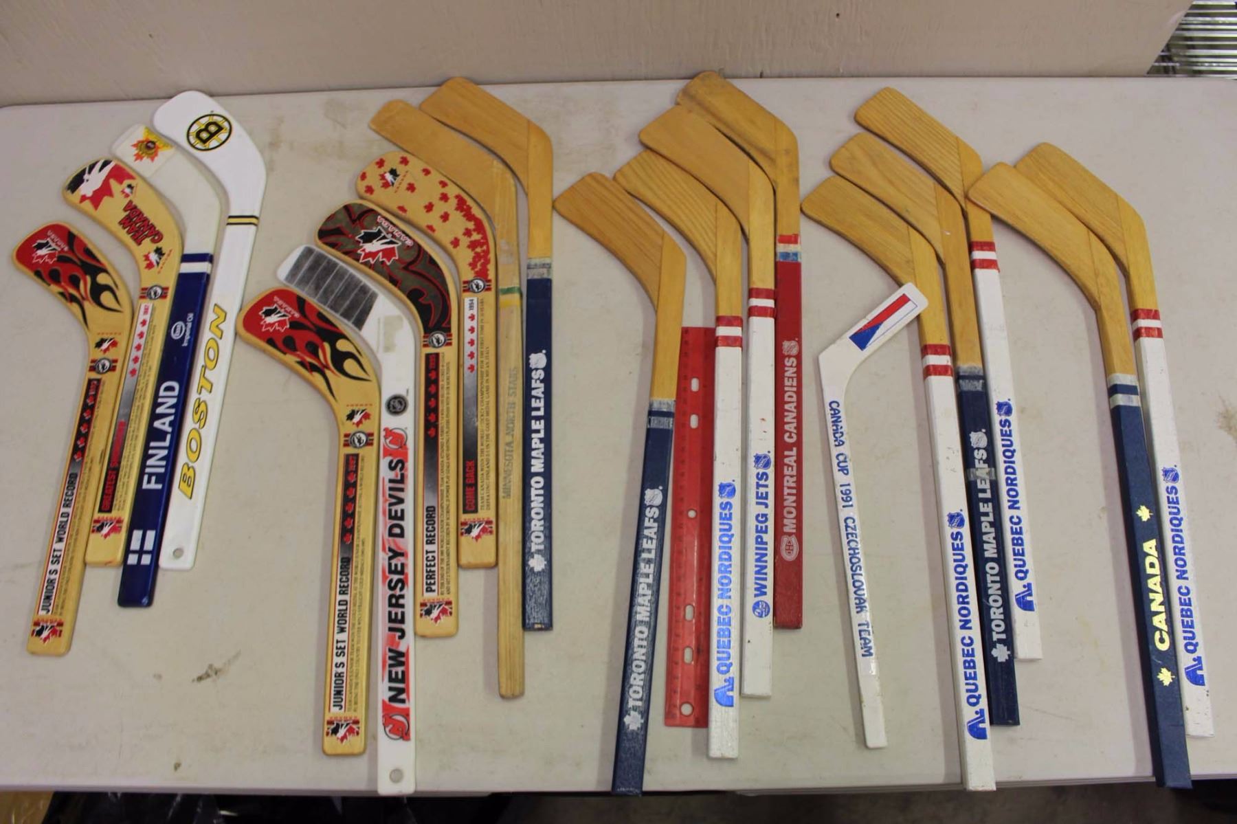 Large Lot Of Mini Hockey Sticks