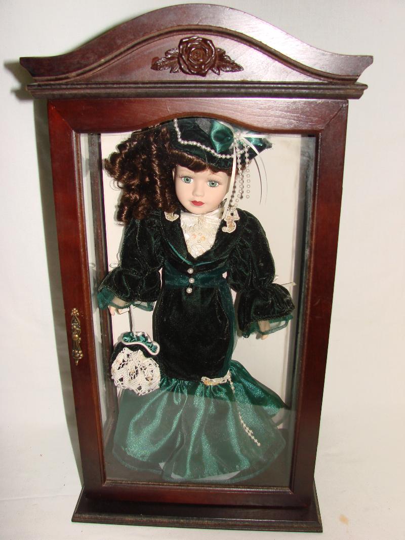 Porcelain Doll In Display Case