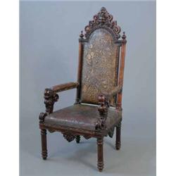 A 19th Century Italian Carved Walnut High Back Chair Upholstered A 19th Century Italian Carved Walnut High Back Chair Upholstered Tooled Leather Seat And C