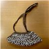 Image 1 : PAPUA NEW GUINEA: nassa shell purse (63.03g), choice VF