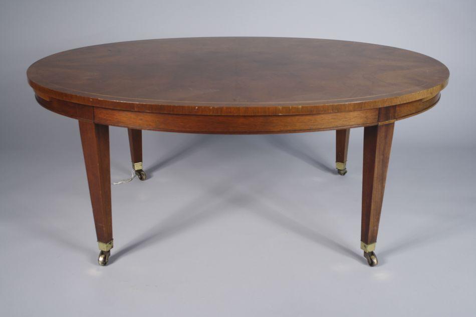 A Mahogany Baker Oval Coffee Table With Pullouts Image 1 A Mahogany Baker Oval Coffee Table With Pullouts
