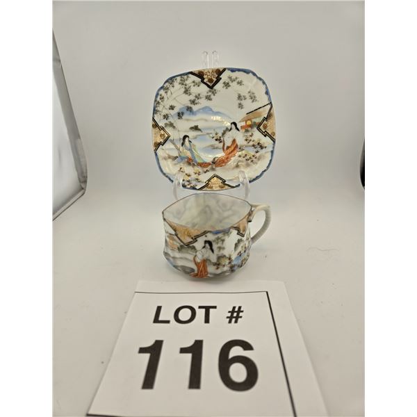 JAPANESE HAND-PAINTED PORCELAIN CUP AND SAUCER WITH FIGURAL SCENE