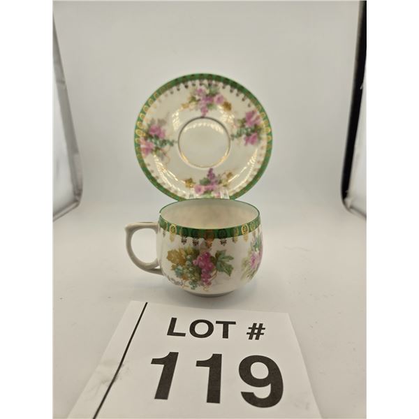 VINTAGE FLORAL PORCELAIN TEACUP AND SAUCER WITH GREEN GILT BORDER