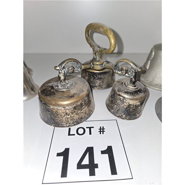 TRIO OF HEAVY METAL BELLS WITH ORNAMENTAL HANDLES