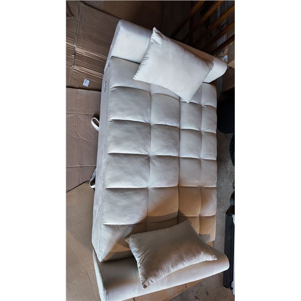 White tufted leather sofa